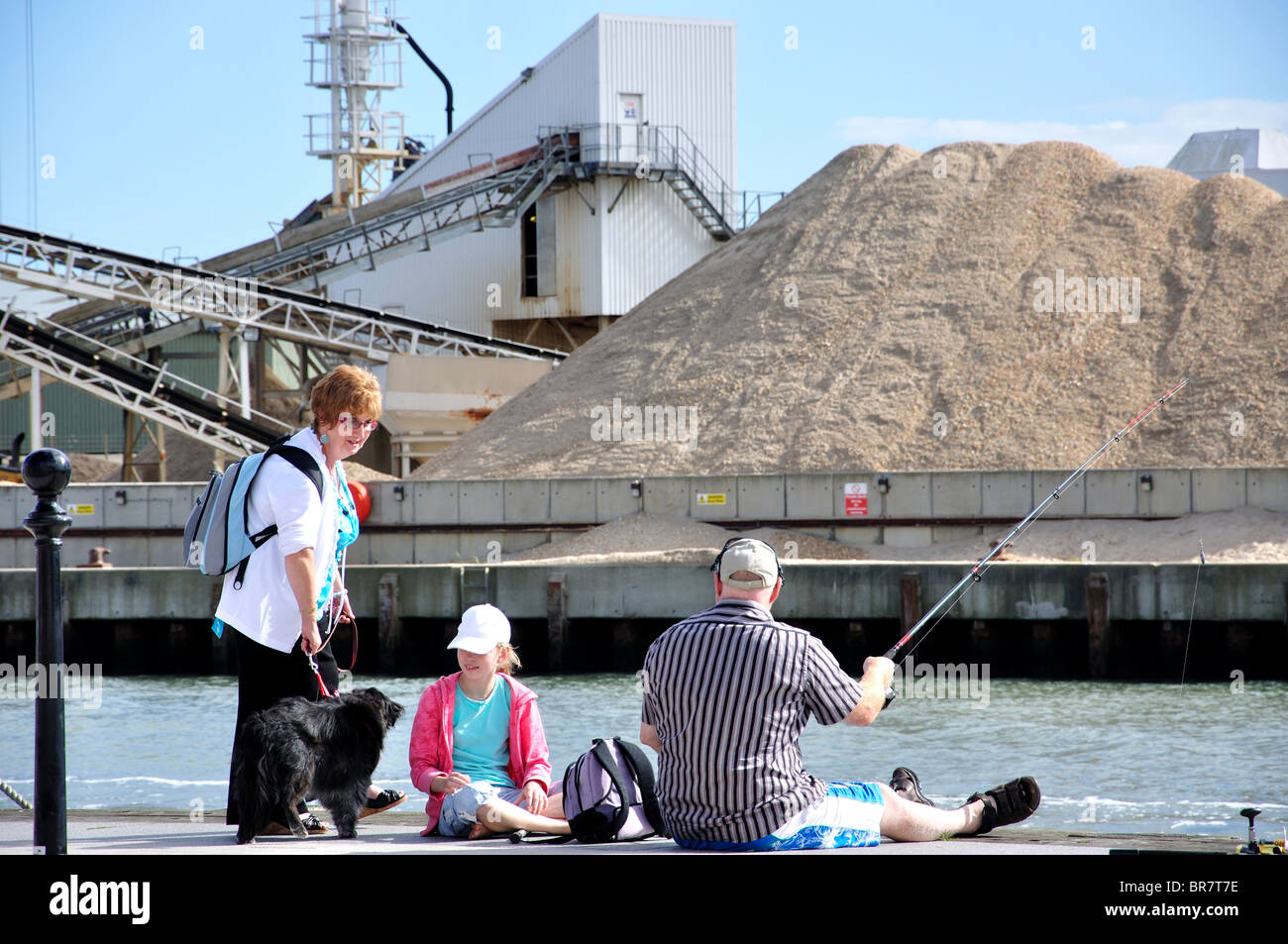 Family fishing on seafront, The Quay, Poole, Dorset, England, United Kingdom Stock Photo