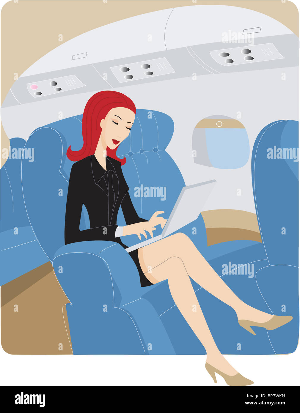 Businesswoman using a laptop while on an airplane Stock Photo