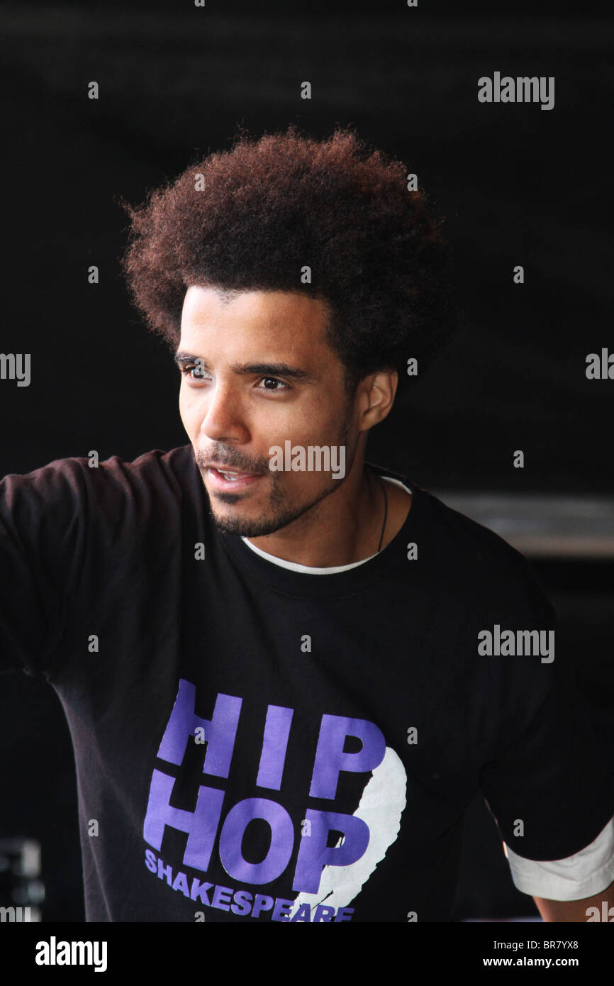 Rapper Kingslee James Daley, The Black Shakespeare singing into ...