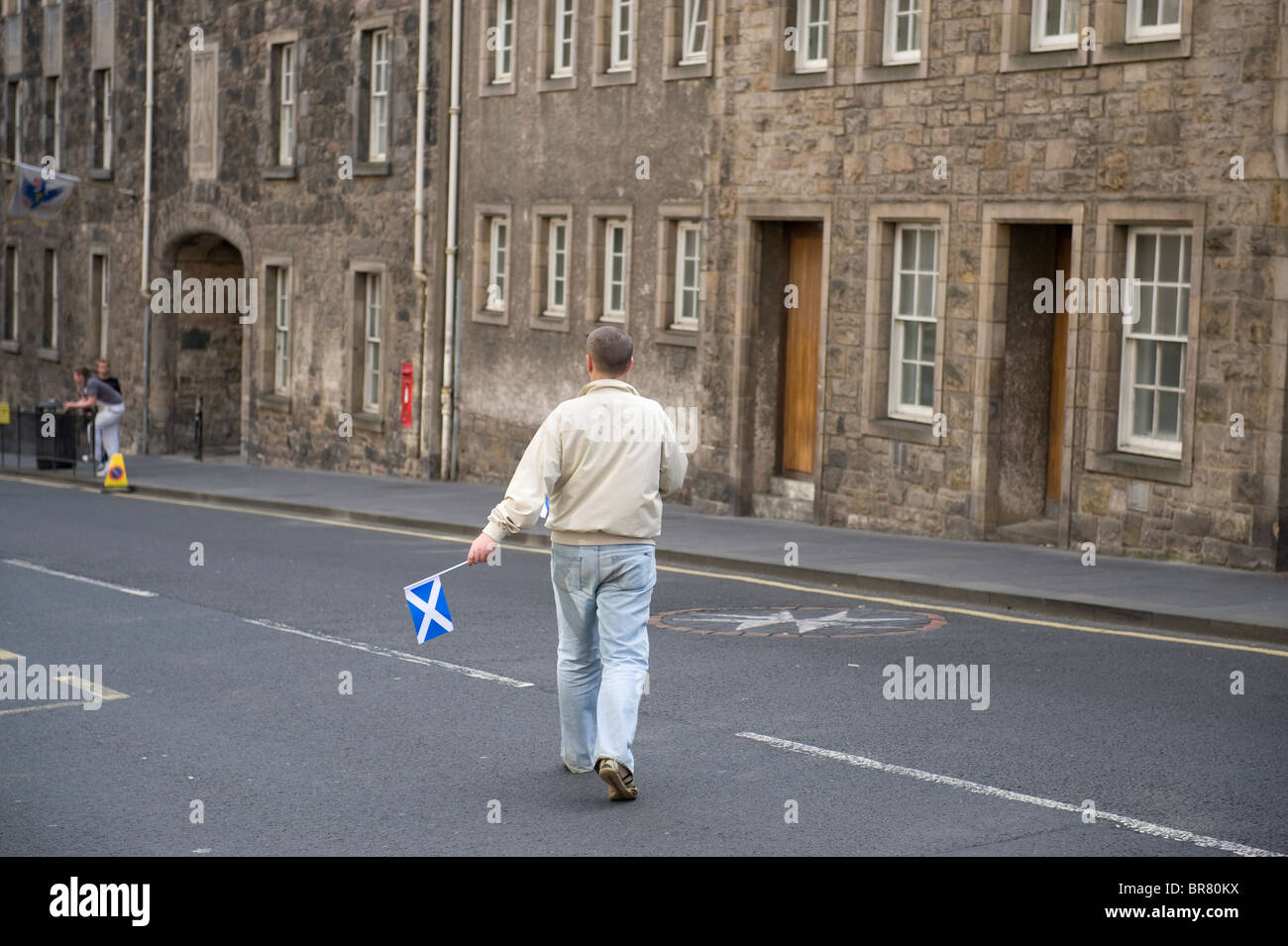 Man waving Scottish Saltire flags on day of Papal visit to Scotland, 16th September 2010 Stock Photo