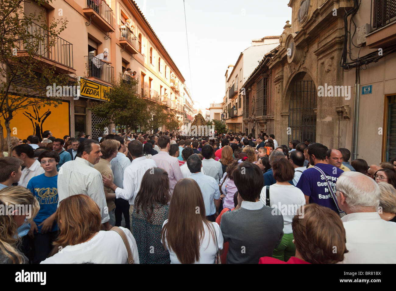 festival crowd following procession of statue of Virgin Mary, Cordoba, Spain Stock Photo