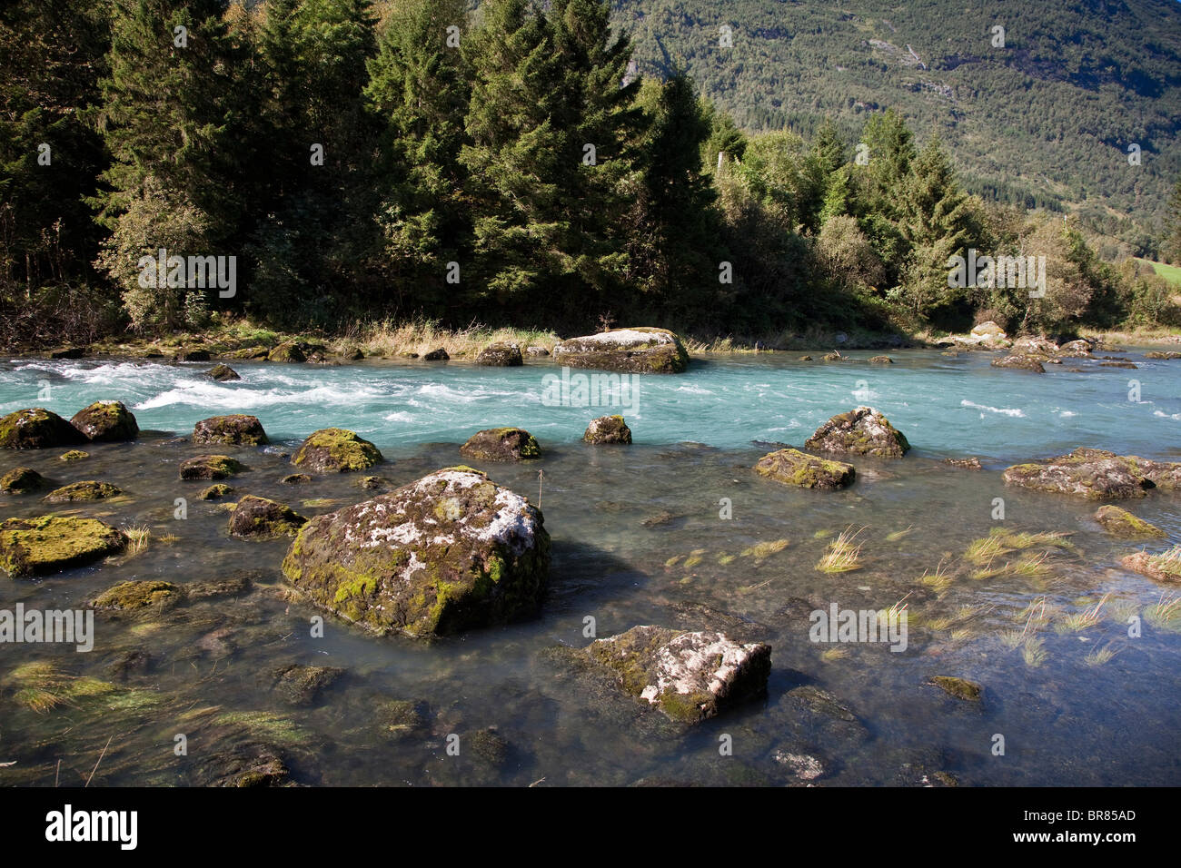 Olden, Norway, melting glacial ice flowing characteristically pure cyan bluish colour Stock Photo