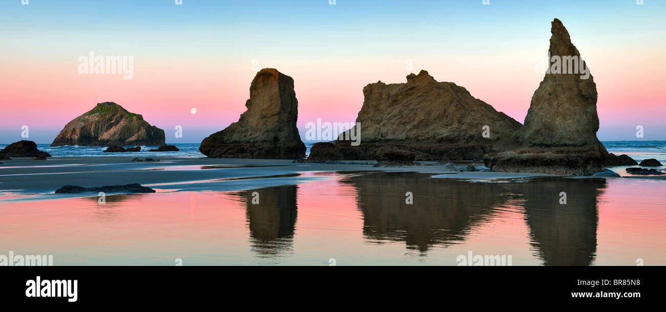Low tide at Bandon beach with full moon set. Oregon Stock Photo