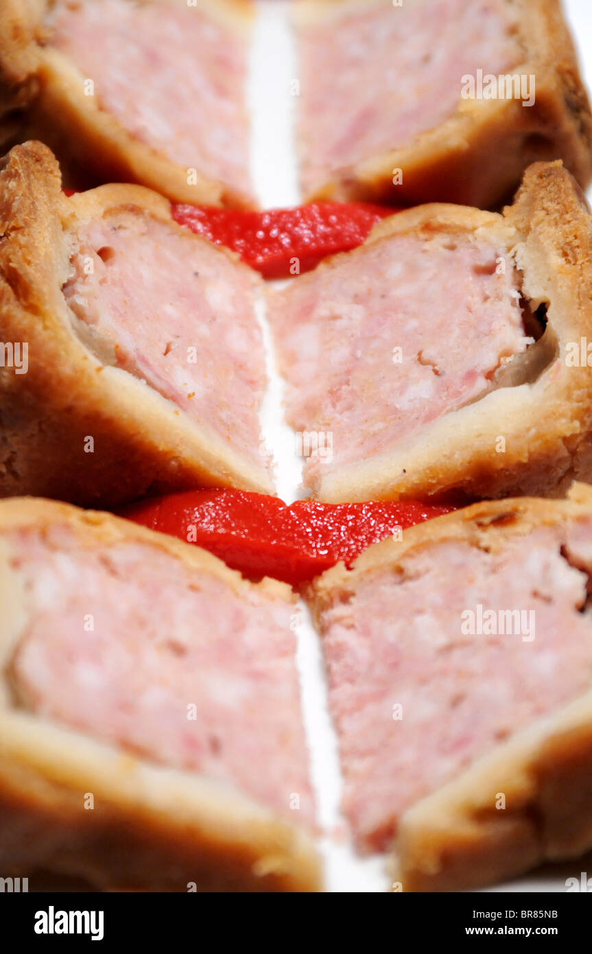 Wedges of common British pork pie. Stock Photo