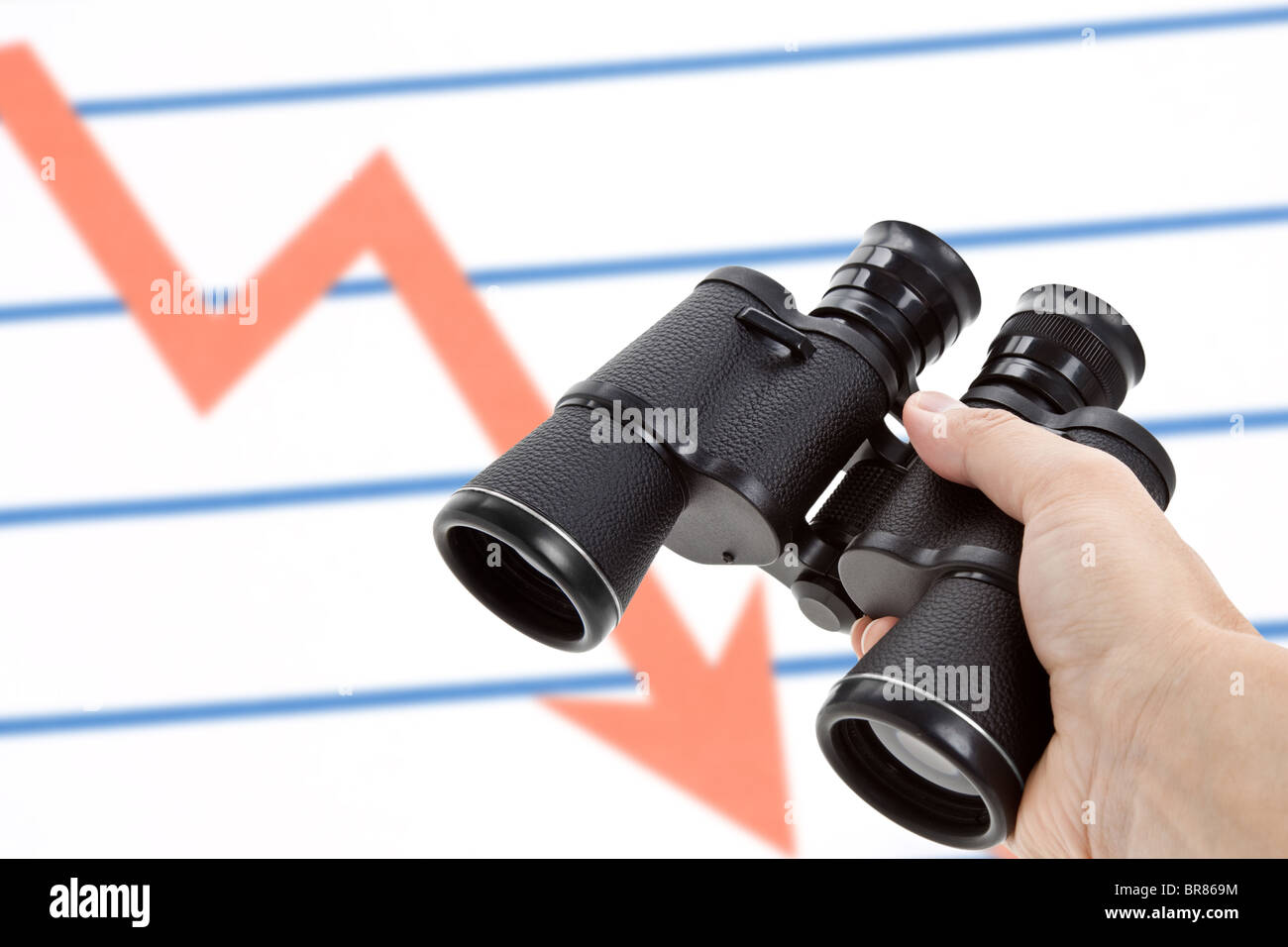 Black Binoculars and Market Chart, Concept of Recession Stock Photo