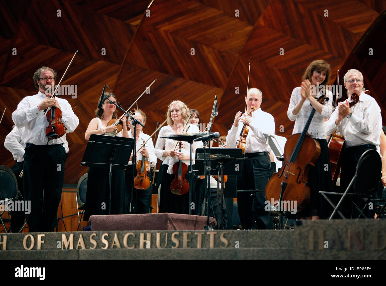 Musicians of the Boston Landmarks Orchestra during an outdoor concert at the Hatch Shell in Boston Massachusetts Stock Photo