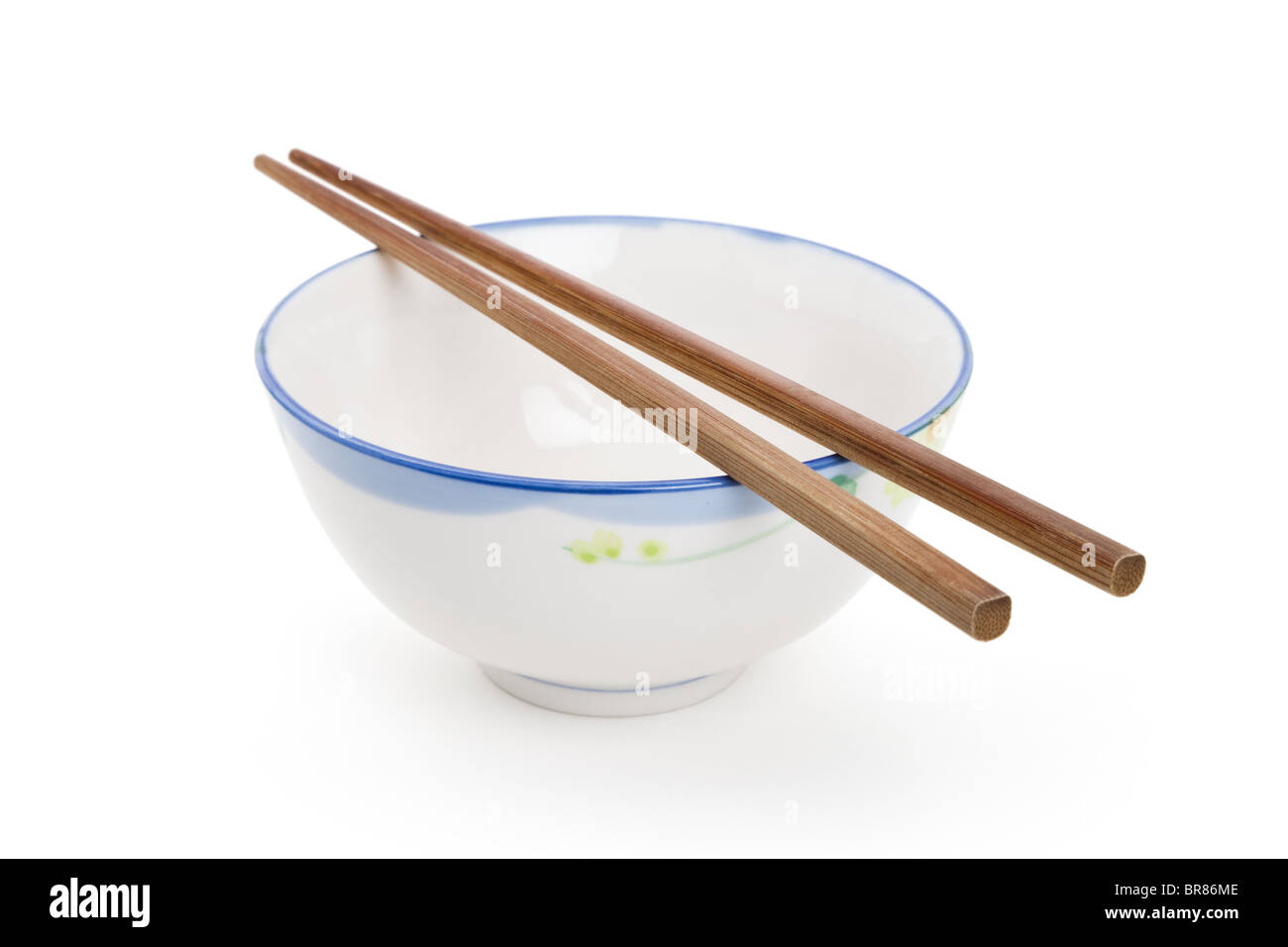 Chopsticks and Bowl with white background Stock Photo