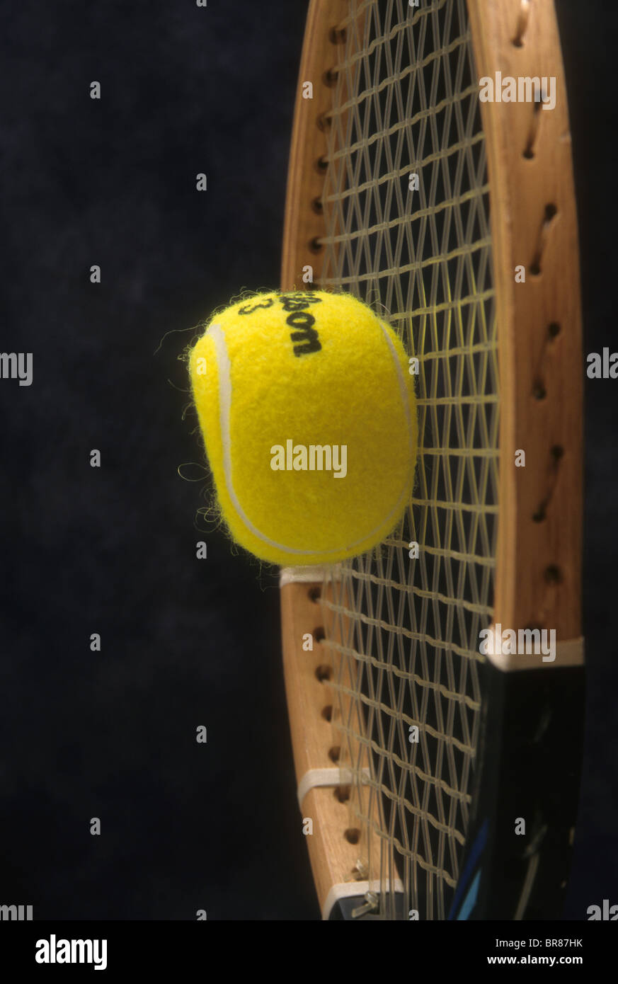 tennis ball impact distort shape hit strike racket flatten form sport  equipment Stock Photo - Alamy