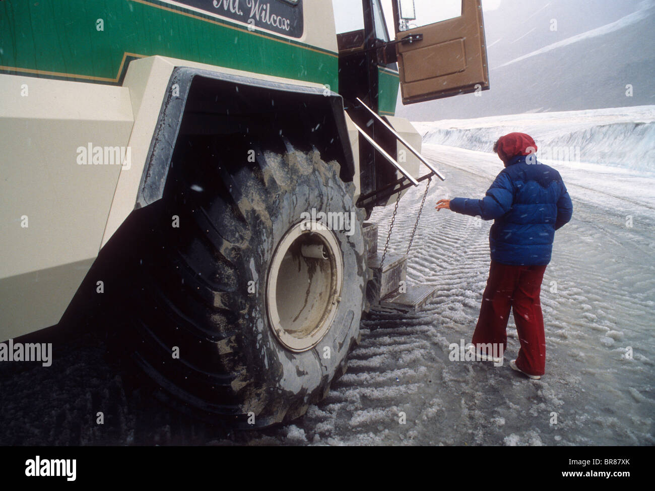 Tourist boards ice bus Athabasca glacier Canada Alberta Columbia icefield nature park ice cold snow vehicle Stock Photo