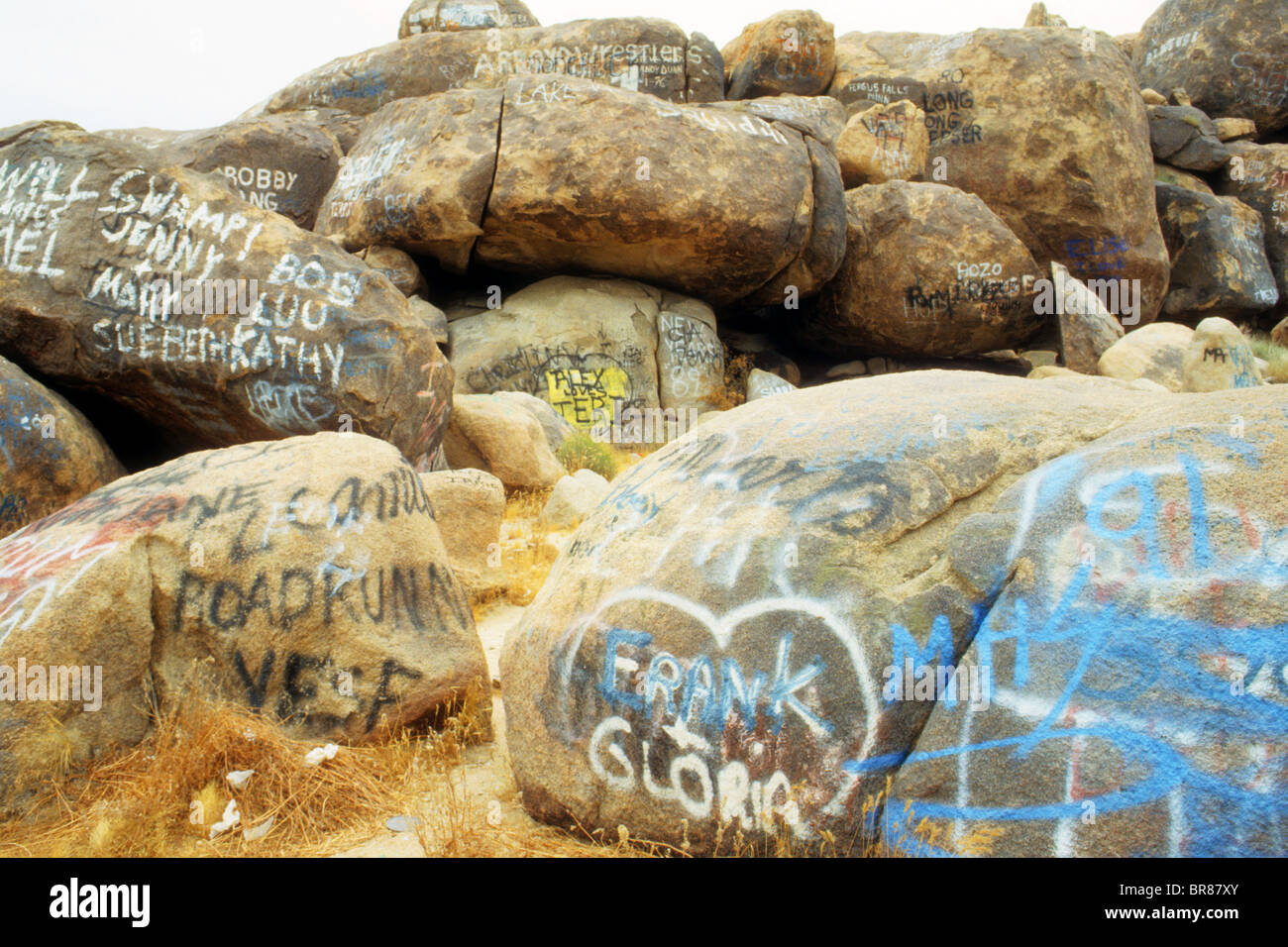 graffiti spray paint name disfigure nature rock desert mark vandal
