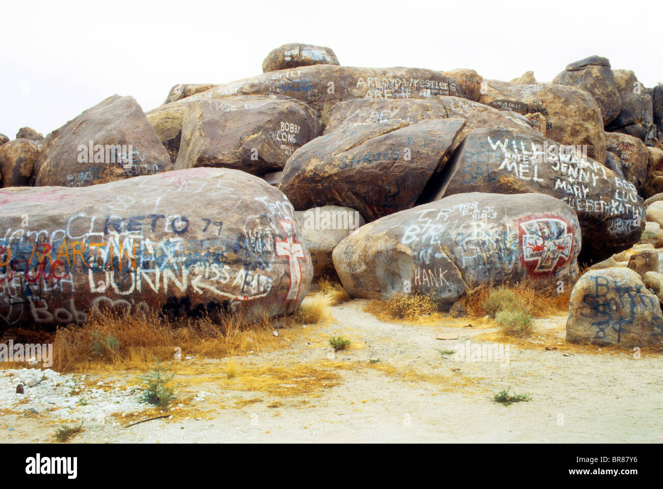 graffiti spray paint name disfigure nature rock desert mark vandal