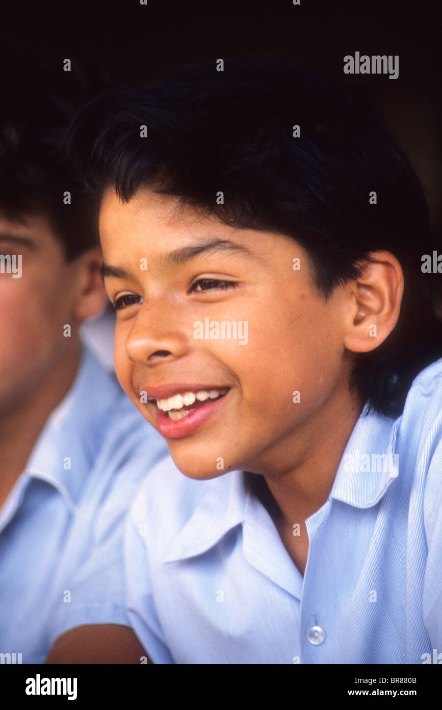 Hispanic student boy smile church school uniform friendly happy portrait face handsome Stock Photo