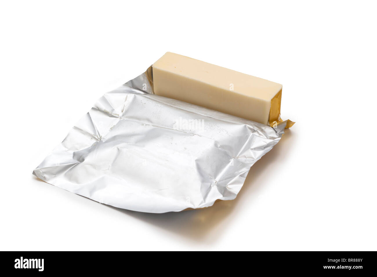 Stick of butter with foil wrapping Stock Photo