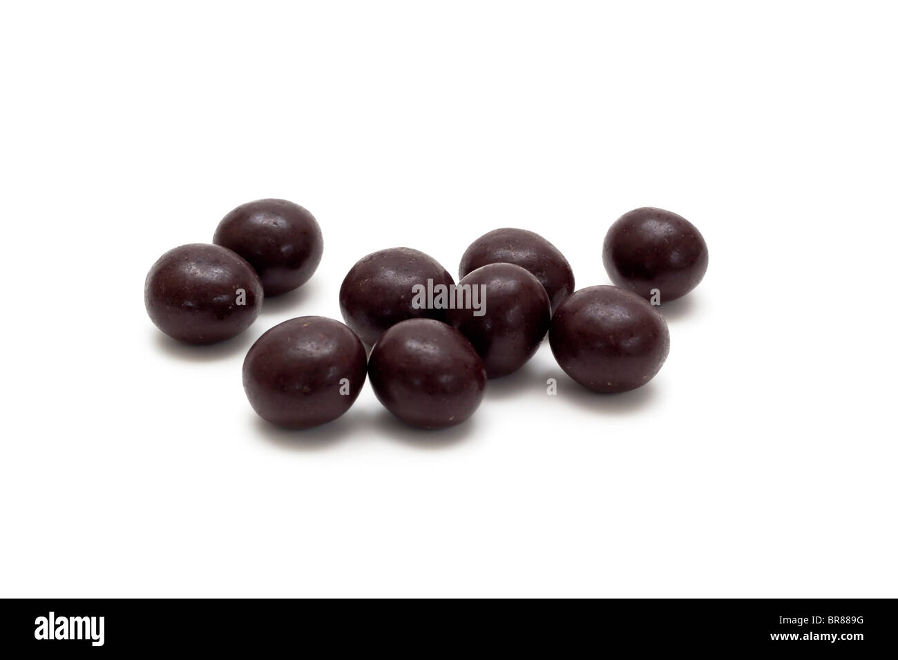 Chocolate covered macadamia nuts Stock Photo