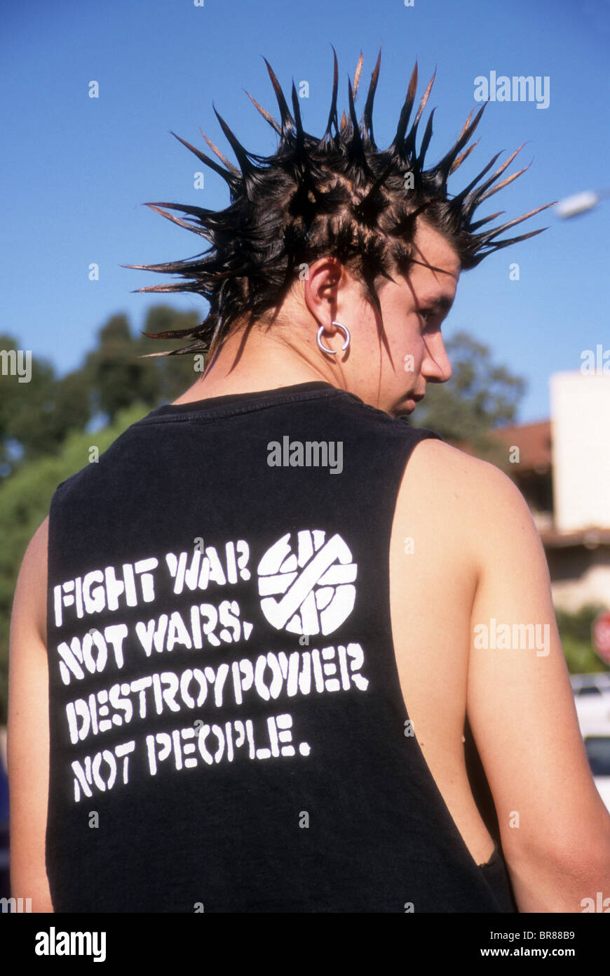 mohawk haircut rebel fight war earring teen male boy profile shirt slogan peace protest hair style Stock Photo - Alamy mohawk haircut rebel fight war earring teen male boy profile shirt slogan peace protest hair style Stock Photo - Alamy