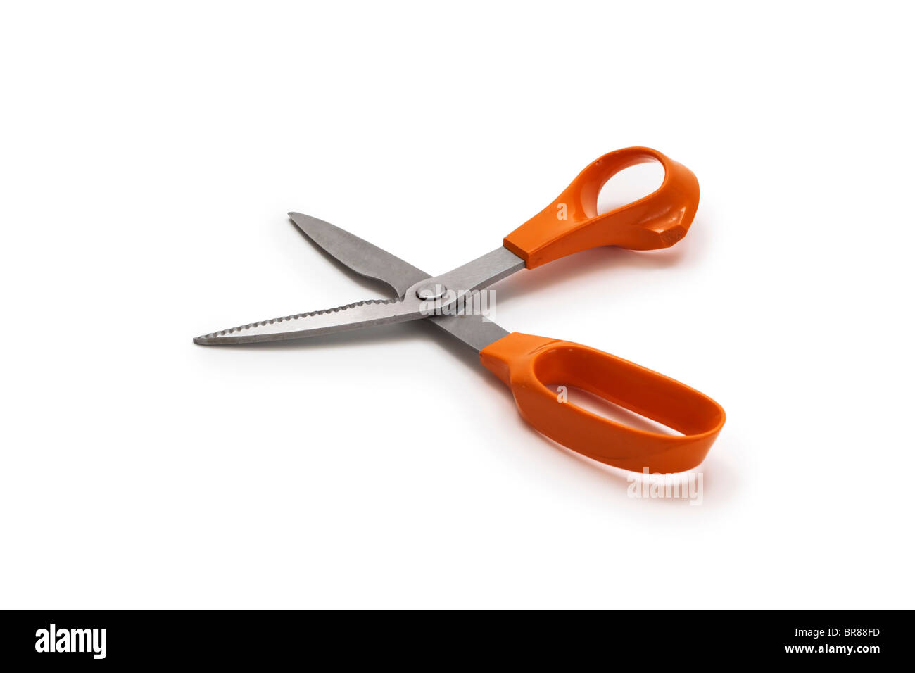 Kitchen scissors with orange plastic handles Stock Photo
