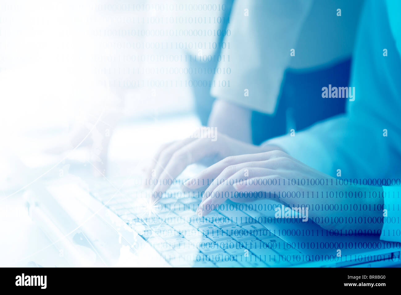 Women using laptop and binary code Stock Photo - Alamy