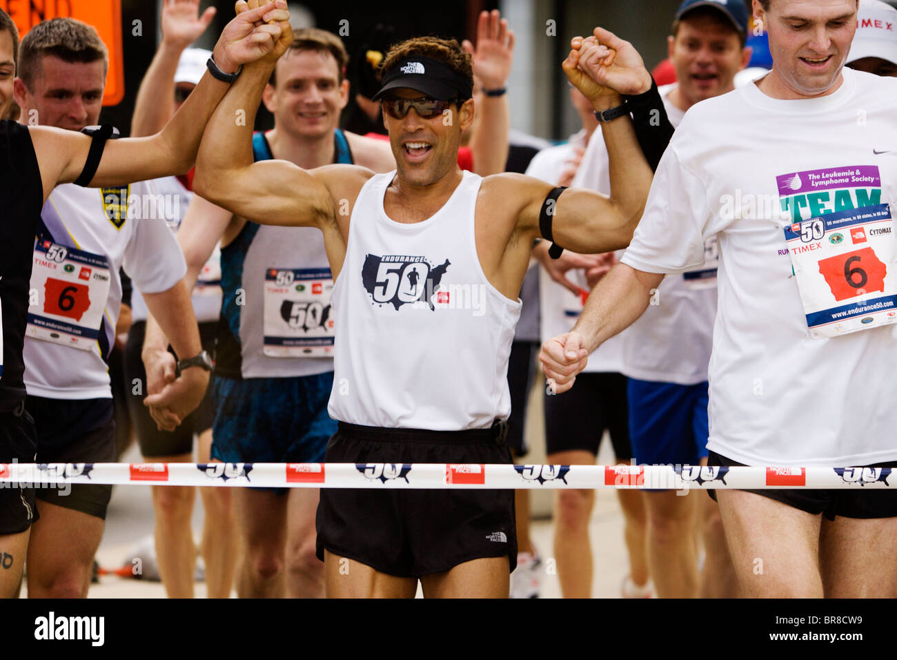 Runners at finish line marathon crowd hi-res stock photography and ...