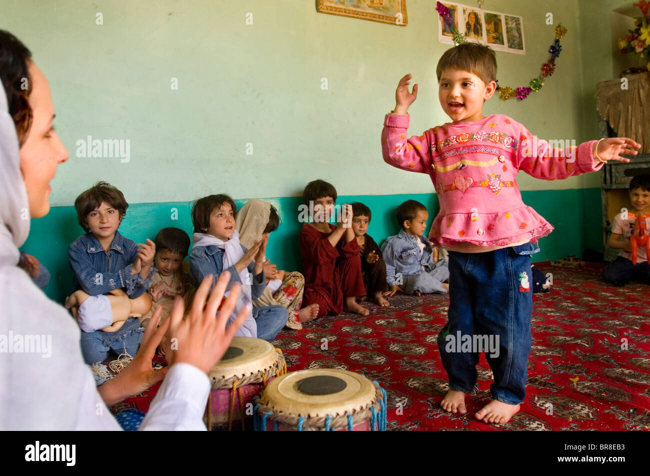Children dance at a day care center in Kabul Afghanistan. Stock Photo