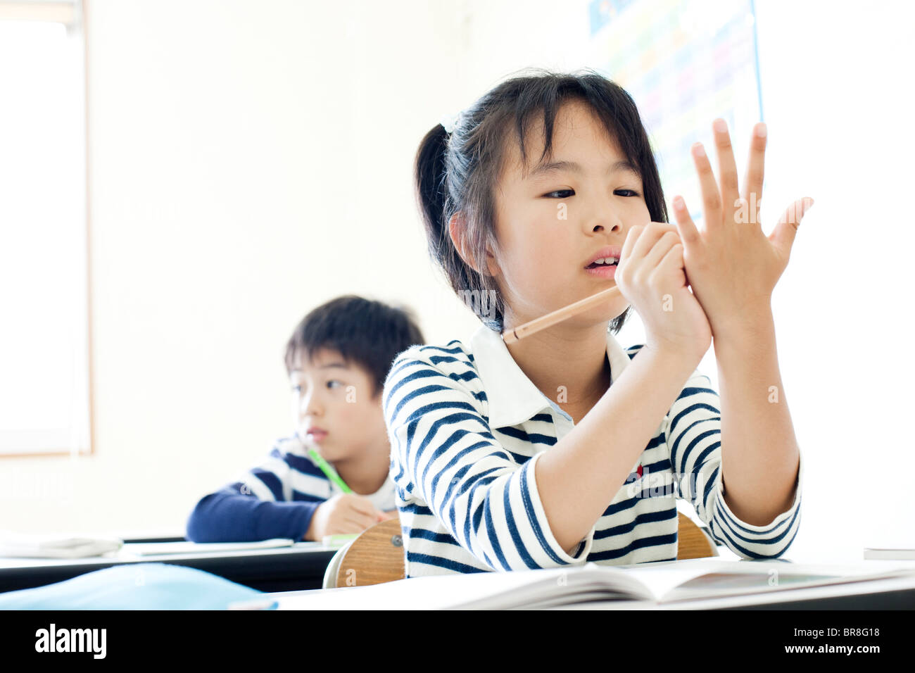 Girl writing on her hand Stock Photo Alamy