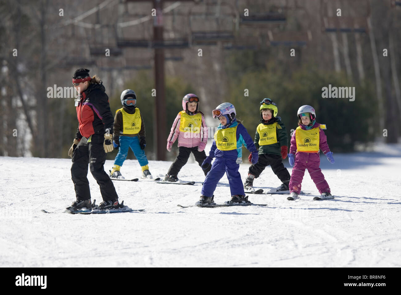 A group of children learn to ski in Newry Maine. Stock Photo