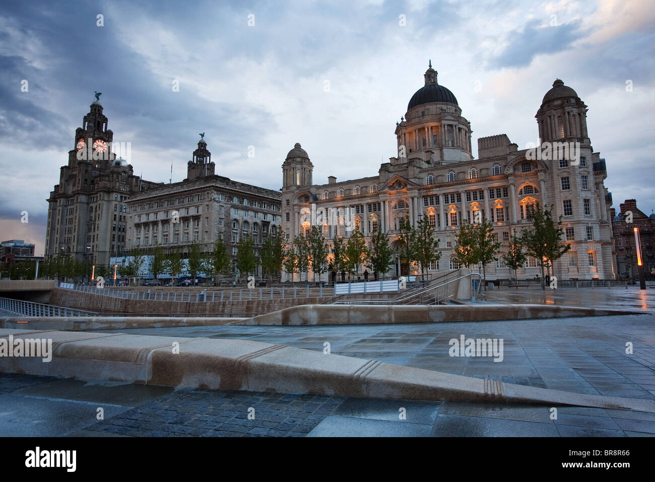 A dramatic stormy evening sky over Liverpool's Three Graces and Canal Link on the Waterfront Stock Photo
