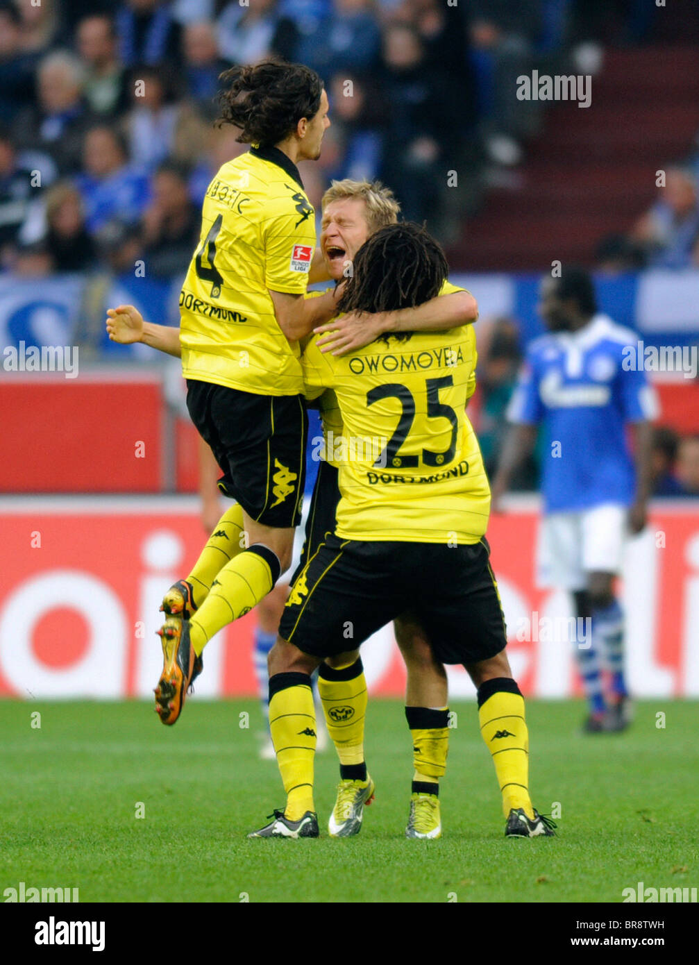 Dortmund player Neven Subotic, Jakub Kuba Blaszczykowski and Patrick Owomoyela (from left), celebrating a goal. Stock Photo