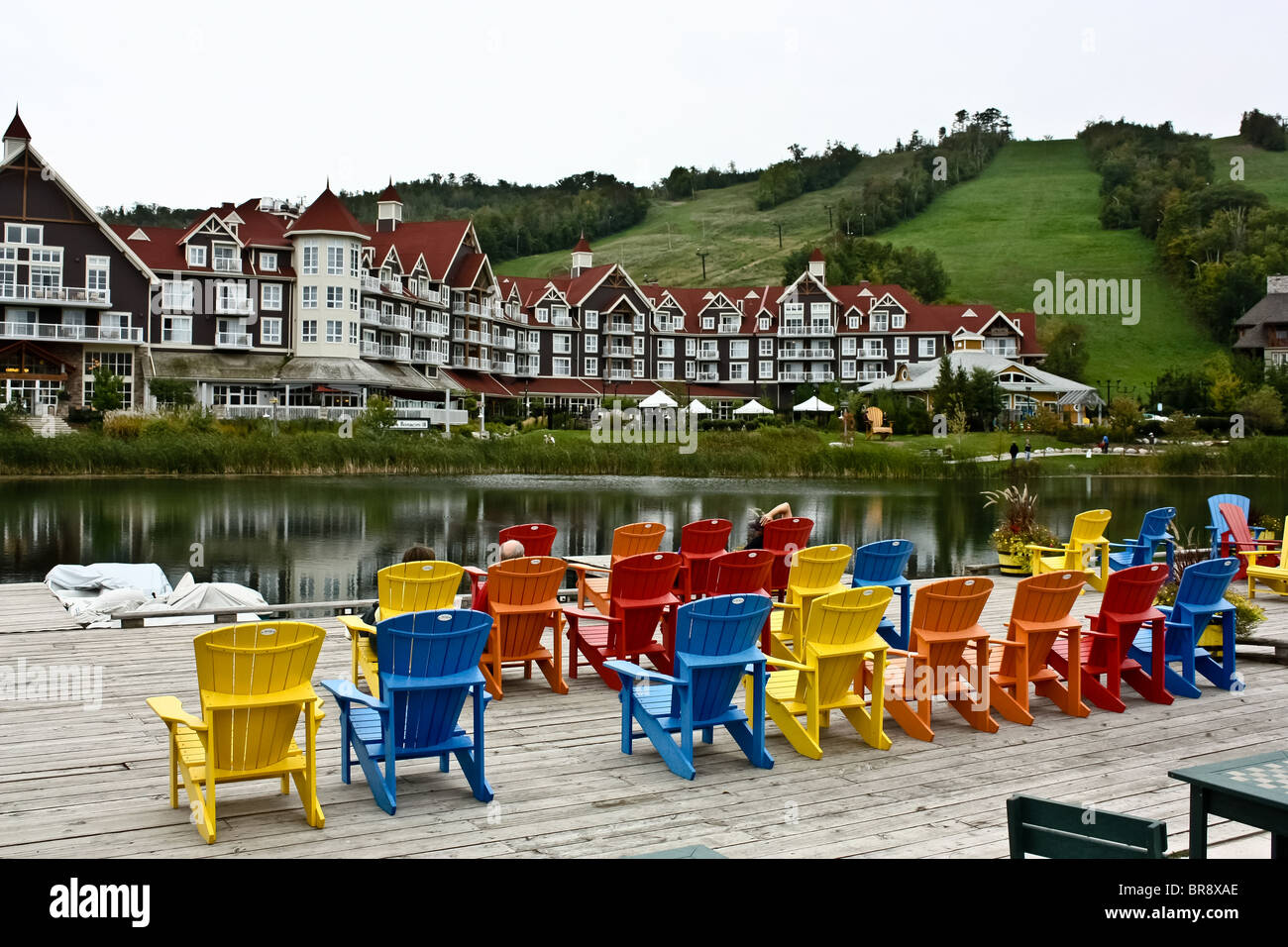 colorful colourful muskoka chair chairs cottage Stock Photo