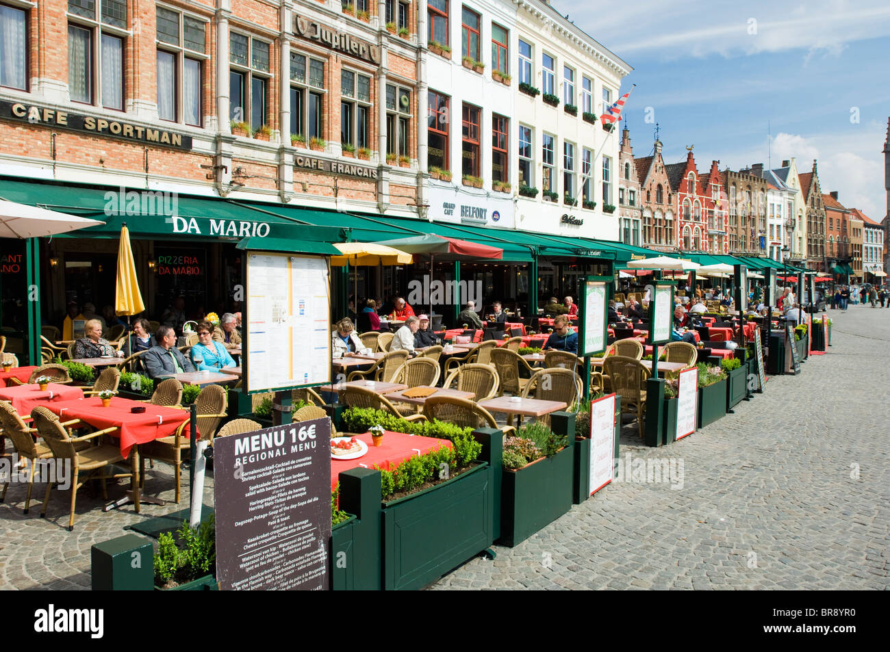 Sunlit cafés lining the Markt in Bruges, Belgium Stock Photo