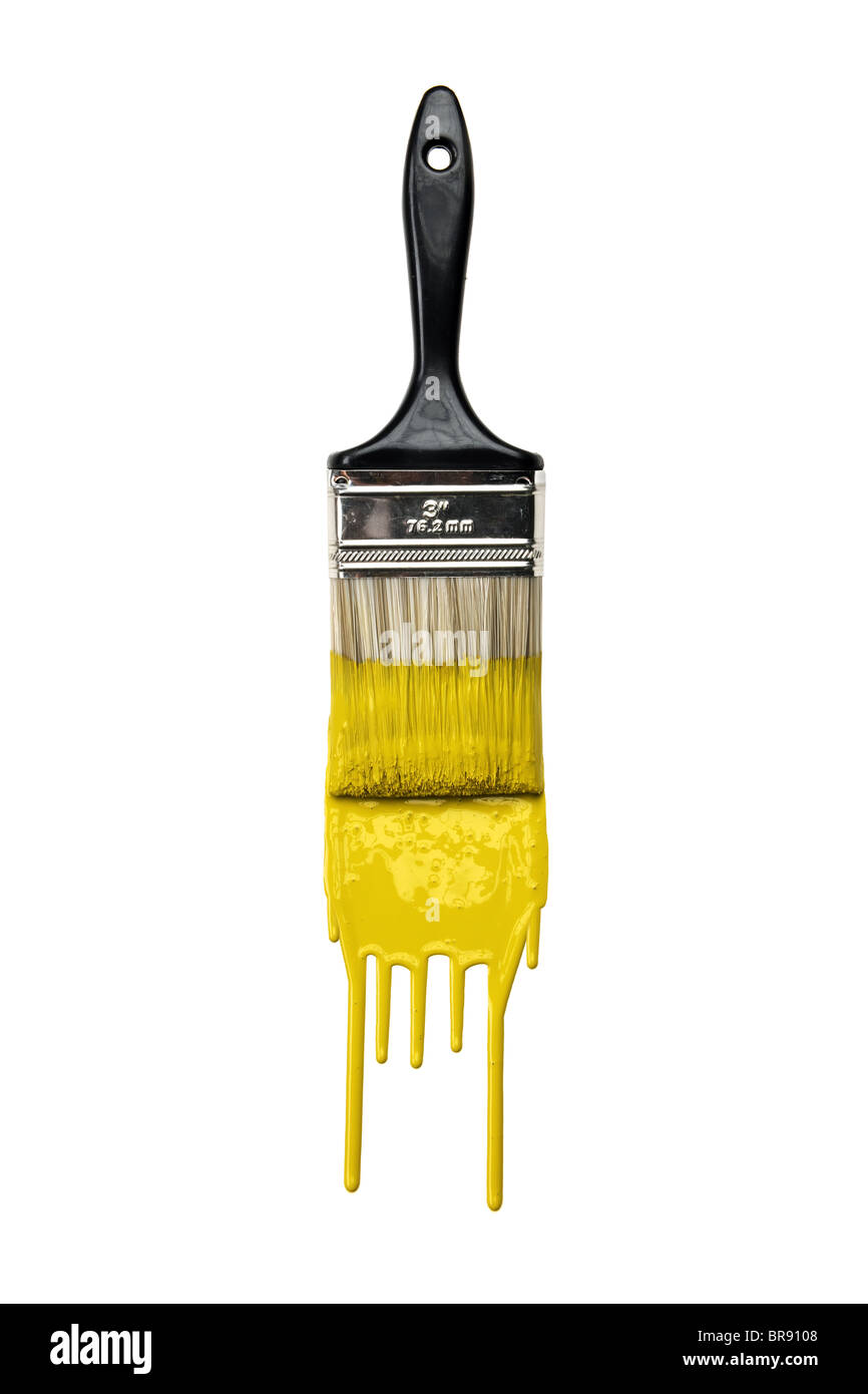 Paintbrush with dripping yellow paint isolated over white background Stock Photo