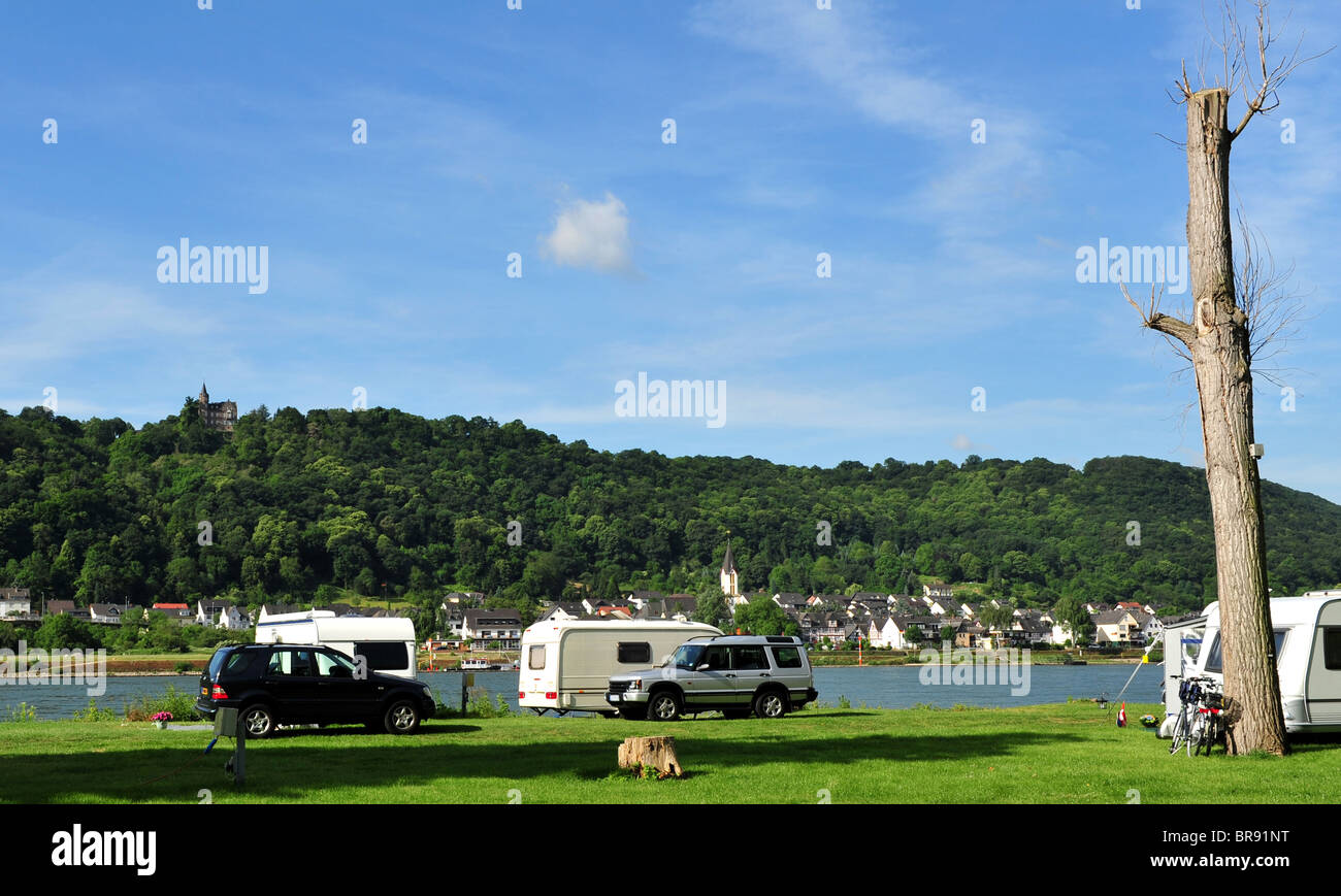 Camping and caravanning beside the busy River Rhine in Germany Stock Photo