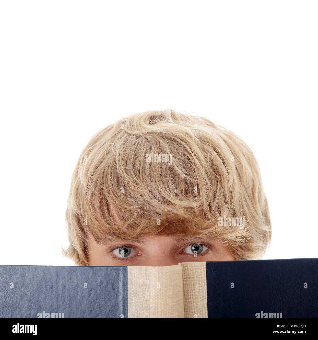 Teen man reading book , isolated on white background Stock Photo - Alamy