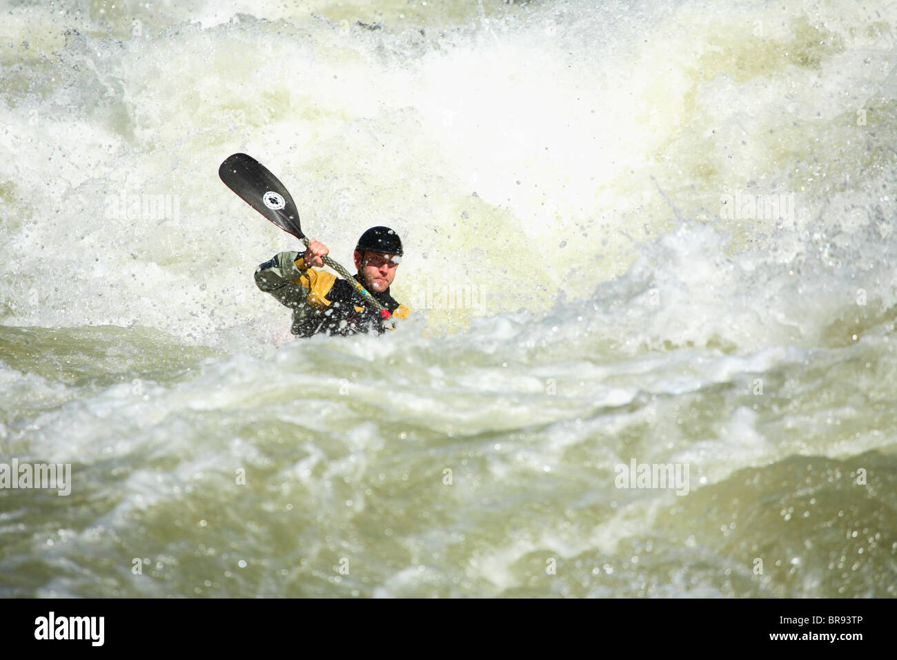 Unknown kayaker punches through Pillow Rock rapid on the Upper Gauley river near Fayetteville WV Stock Photo