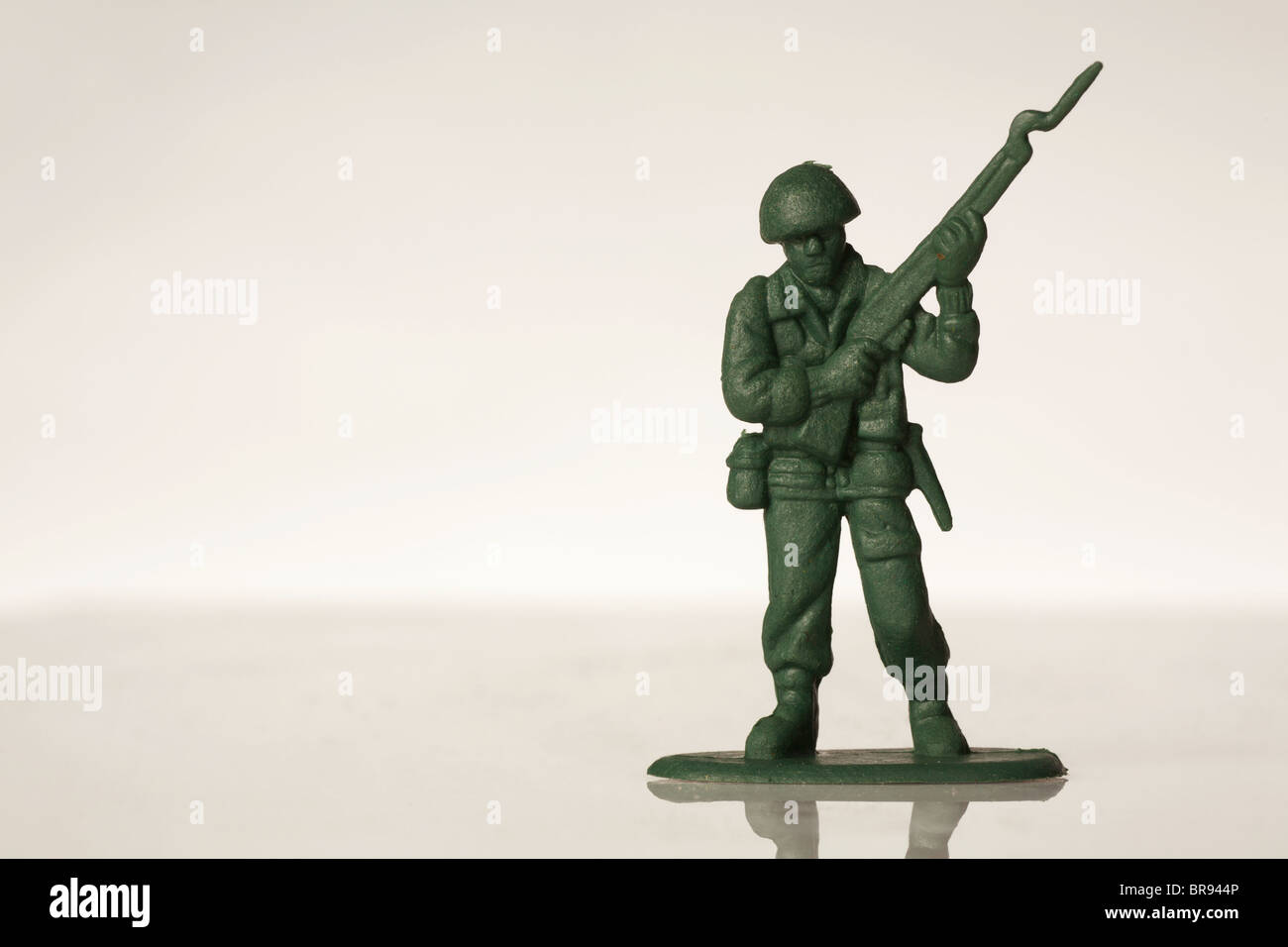 green toy soldiers on white back ground Stock Photo - Alamy