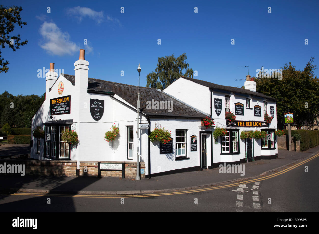 False door way painted on the front of a pub to keep architectural symmetry and to confuse anybody who had enough. Stock Photo