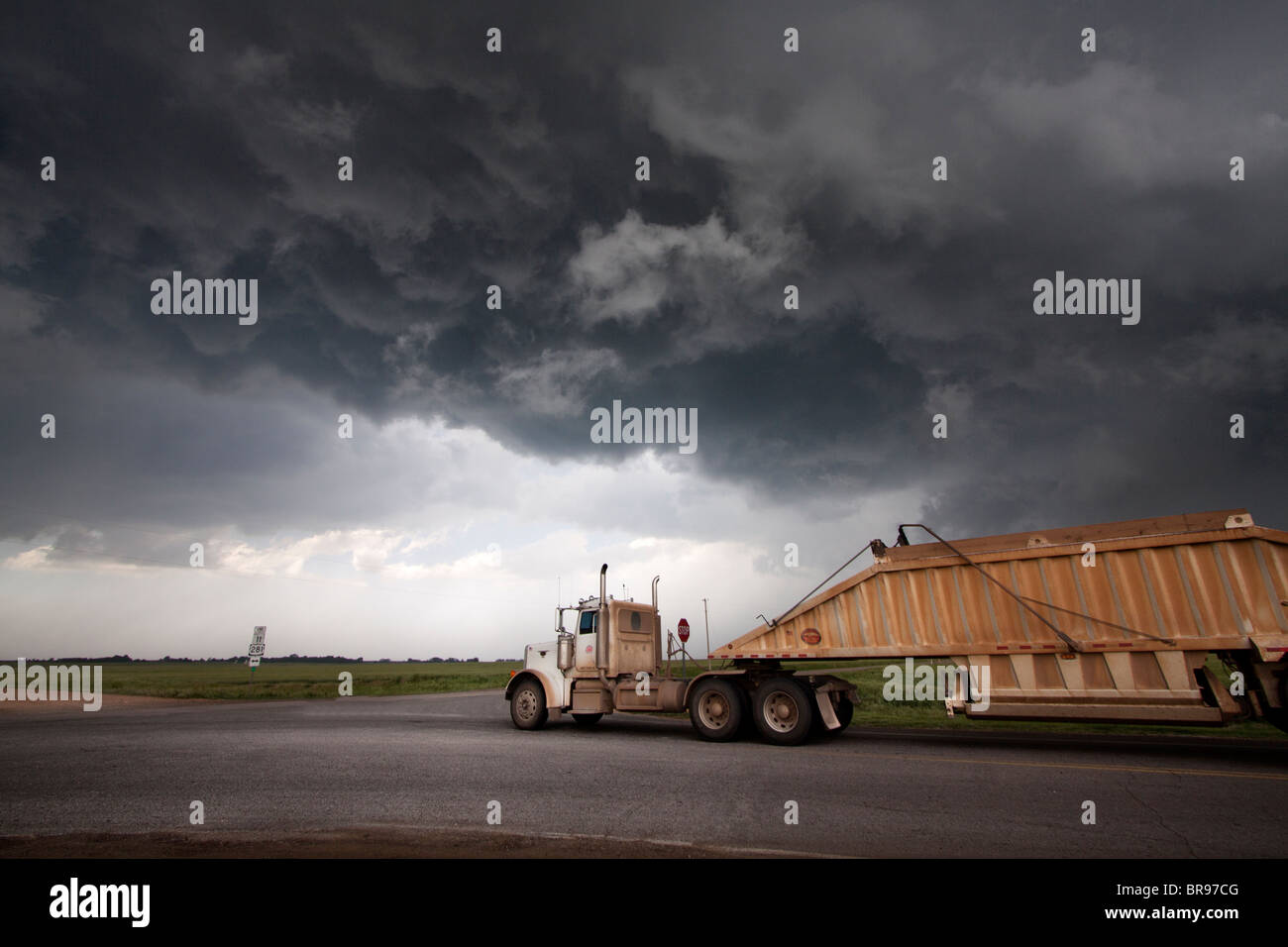 A semi truck (lorry) framed against the updraft base of a severe storm in Oklahoma; May 12; 2010. Stock Photo