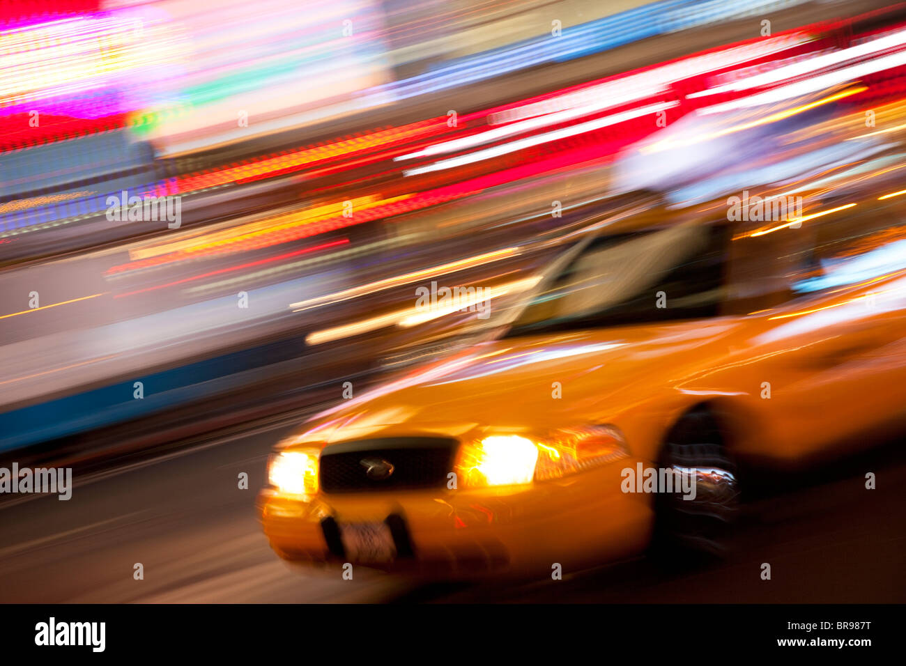 Taxi Cab at night in Times Square, Manhattan, New York City USA Stock Photo