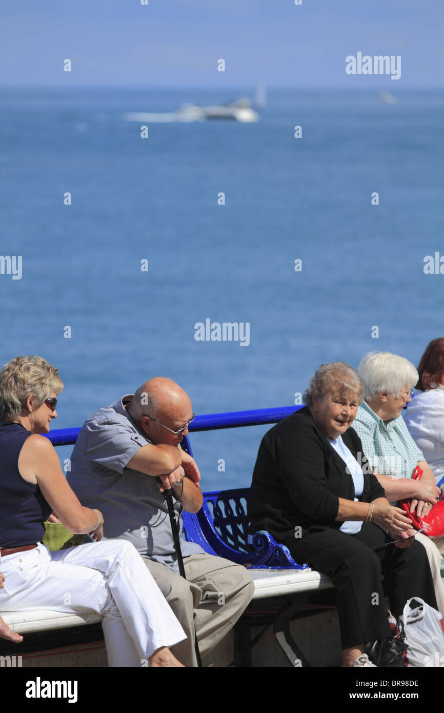Taking a rest on the Pier, Eastbourne, East Sussex, England. Stock Photo