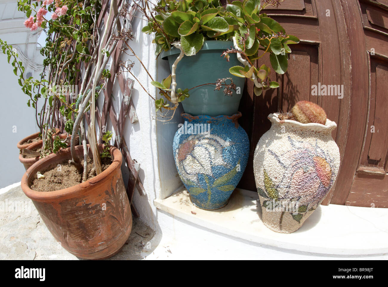 Flower Pots Outside Classic Villa  In Lindos Rhodes Greek Islands Greece Hellas Stock Photo