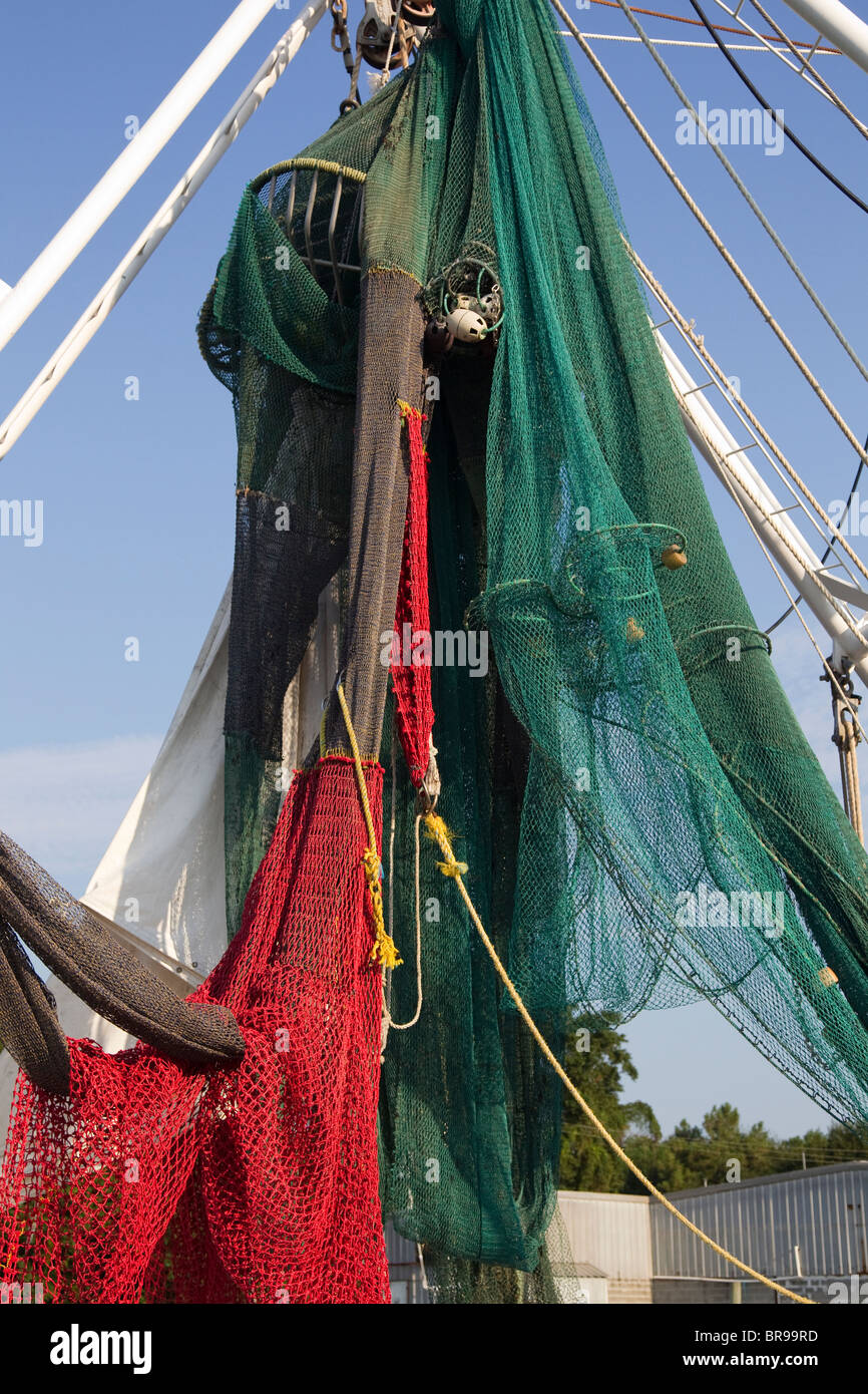 Shrimp boat with shrimp net and TED (turtle excluder device) in Bayou La Batre, Alabama, in port Stock Photo