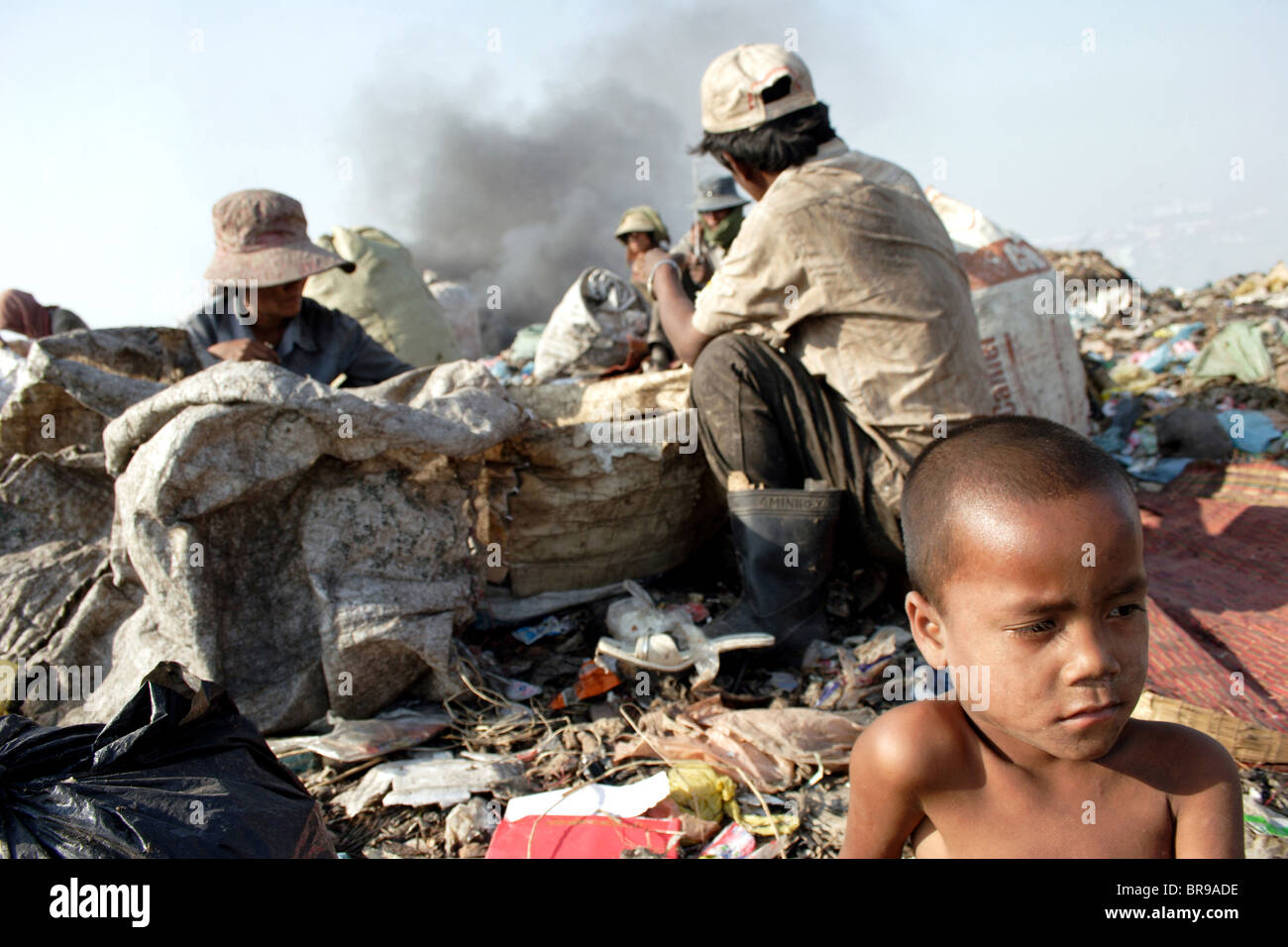 A child laborer boy who scavenges through garbage at The Stung Meanchey ...