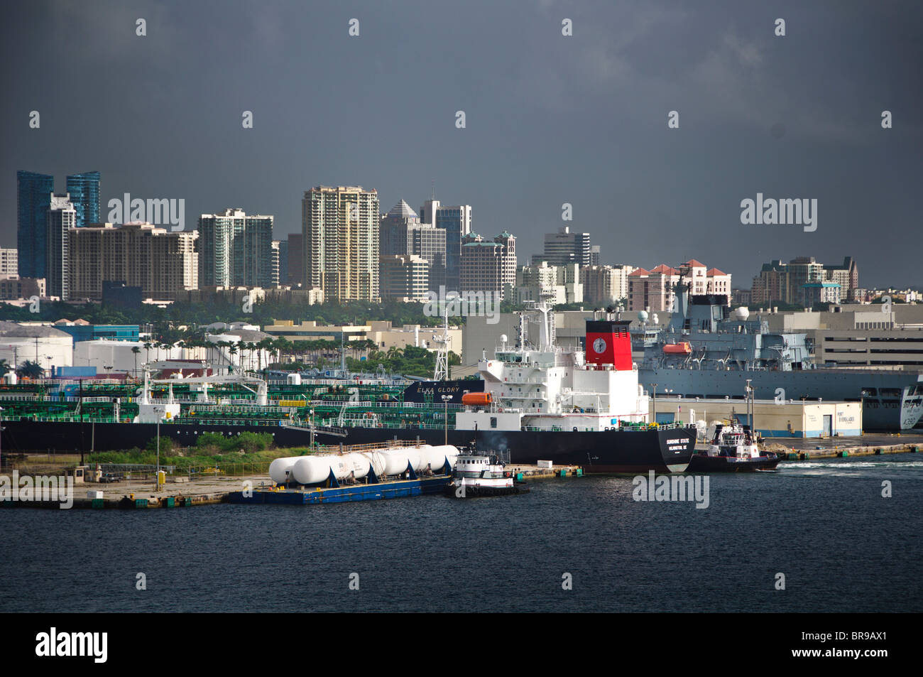 Port Everglades, Florida, USA. Oil tanker, Sunshine State docking with assistance of Seabulk Towing tug, New River. Stock Photo