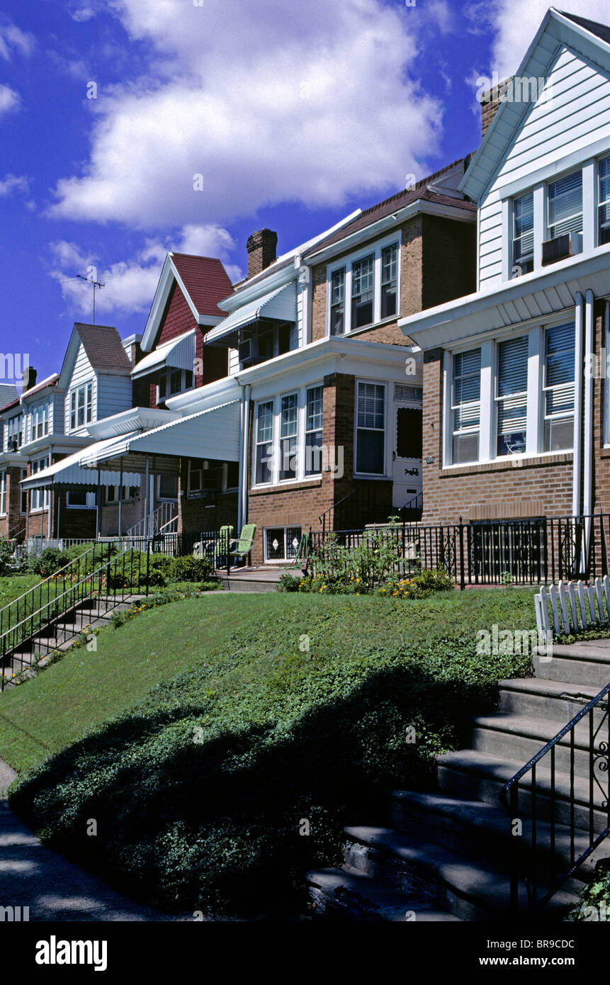 ROW OF HOMES ALONG STREET FRONT LAWNS SUBURBAN NEIGHBORHOOD Stock Photo