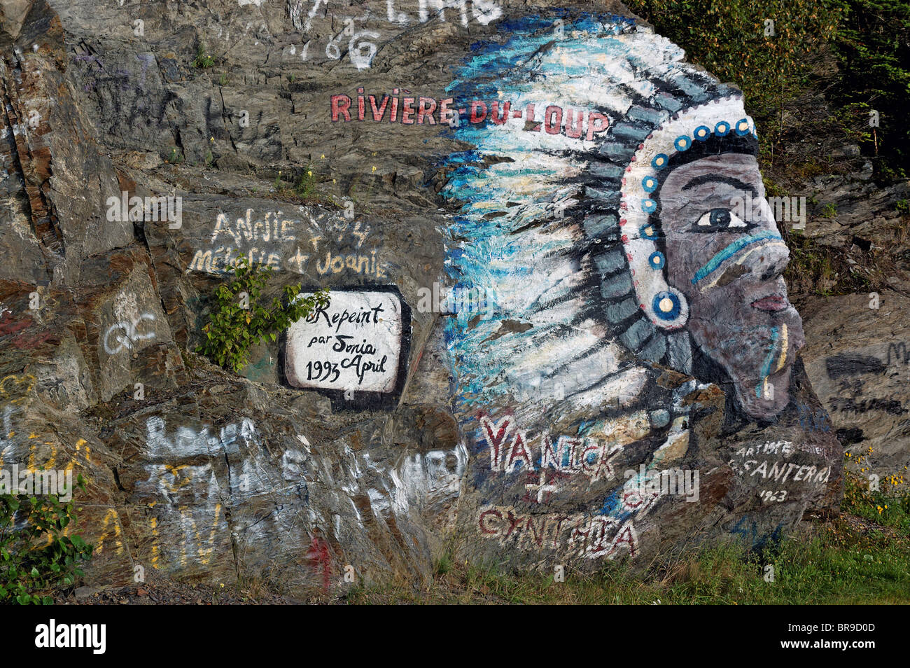 A painting of an Indian chief painted on a rock Stock Photo