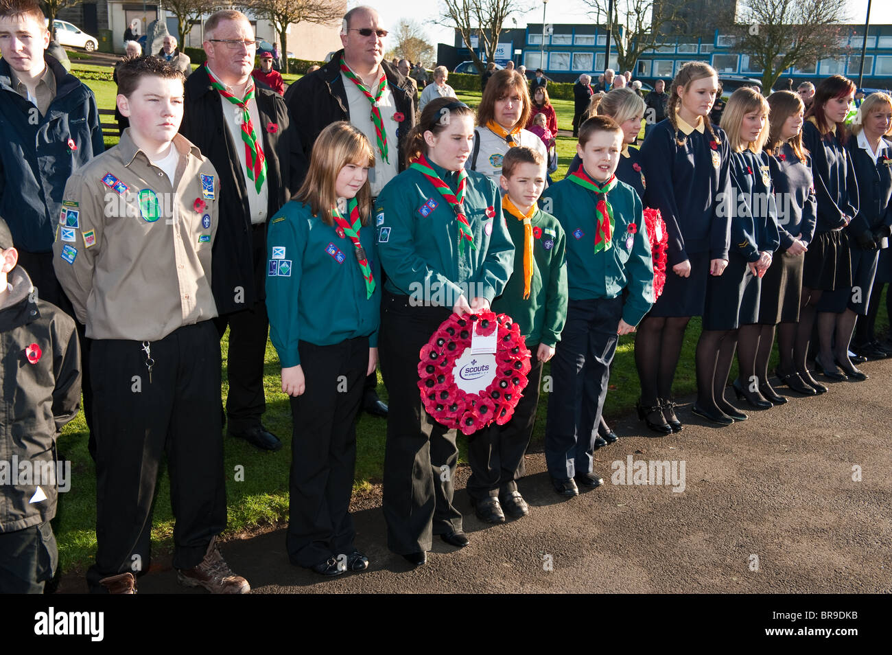 Scouts and Guides on parade at a Remembrance Day Service in Carluke