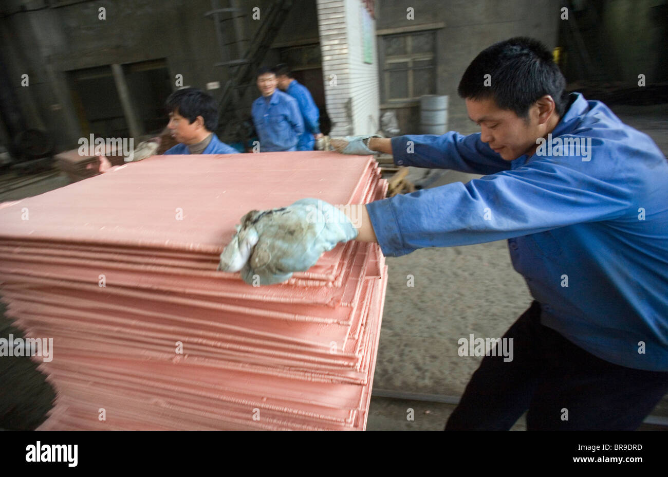 Laboring at a copper smelter Tongling Anhui Province China. Stock Photo