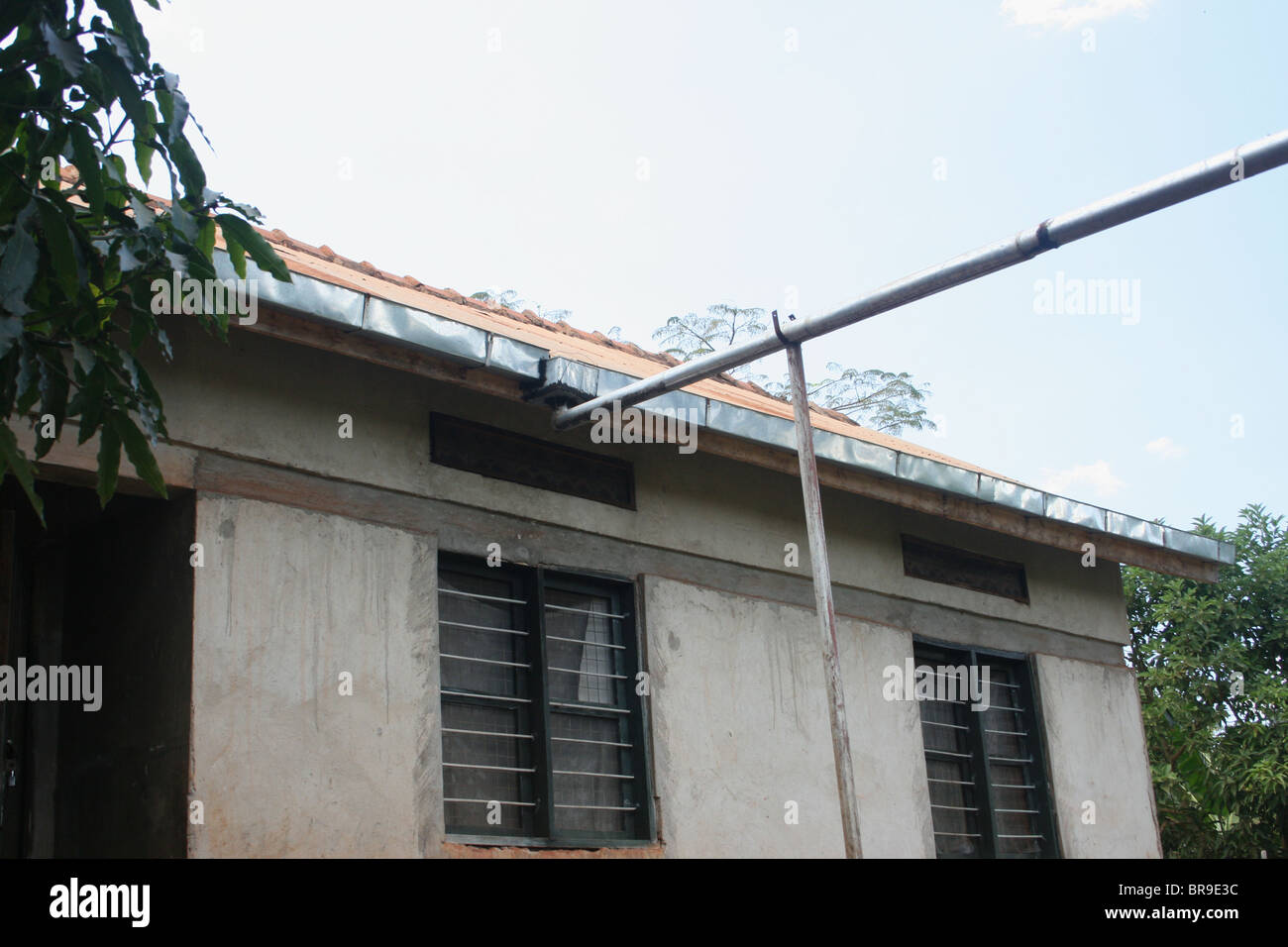 Rainwater collection from a roof through gutters and pipes to a water