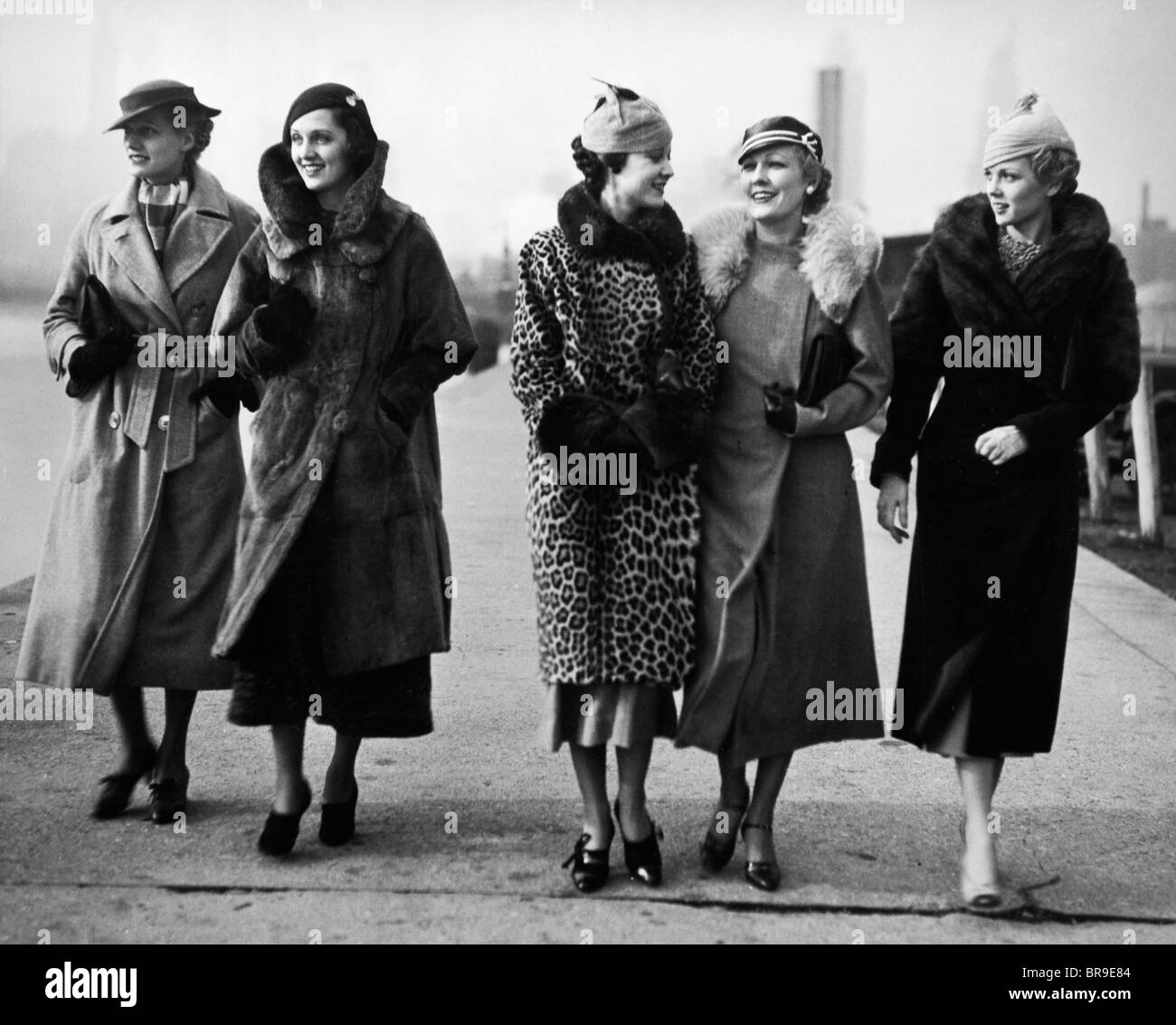 1930s FIVE WOMEN WALKING WEARING WINTER FUR COATS Stock Photo - Alamy