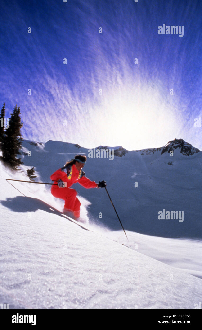 1970s DOWNHILL SKIER IN CANADIAN ROCKIES CANADA Stock Photo