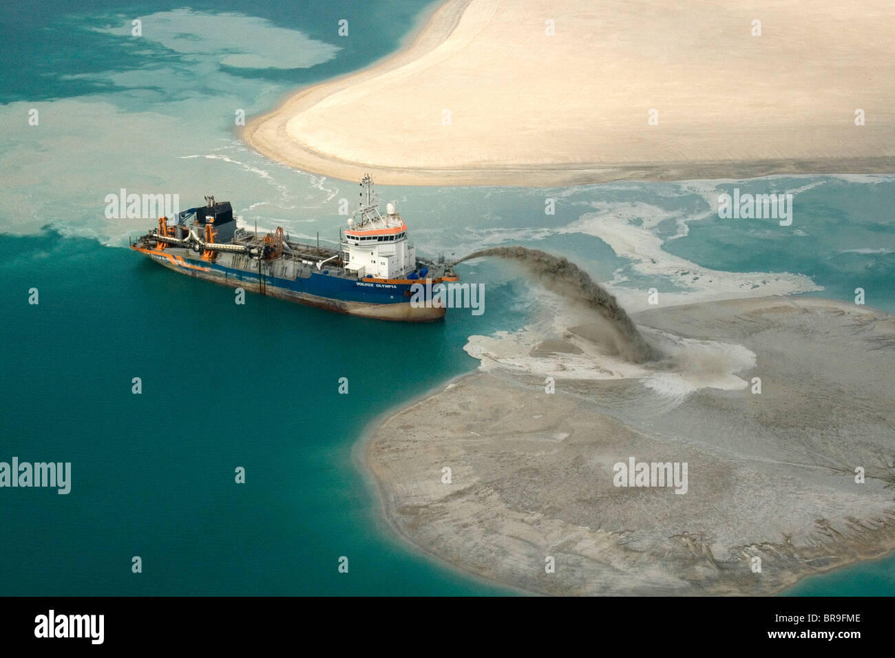 A dredger pumping for land reclamation in the Gulf off Dubai Stock Photo